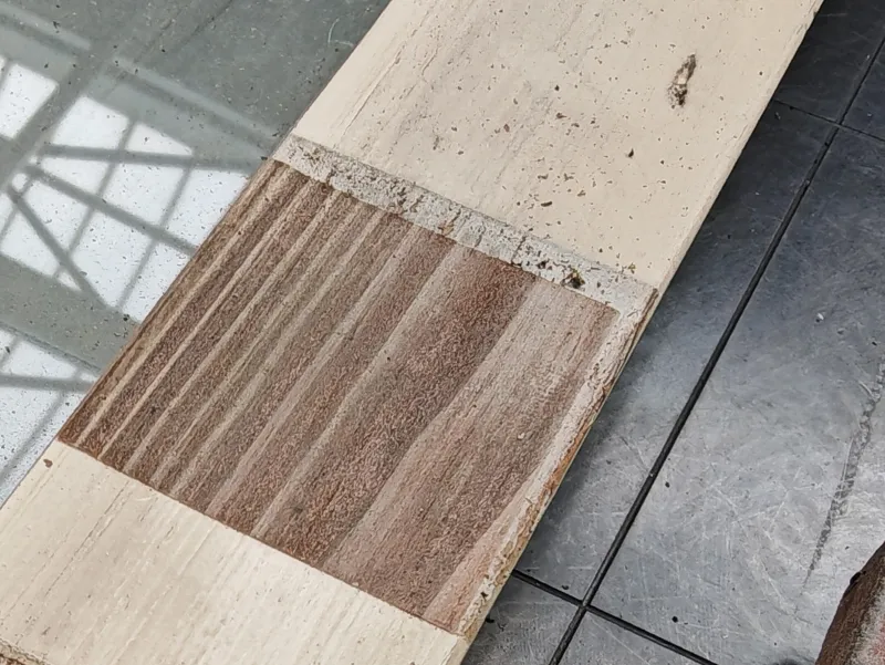 Wooden window frame cleaned of white paint with a pulsed laser